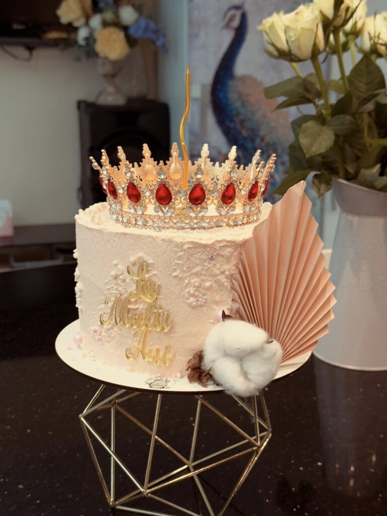 Lory Sweets pastry chef with a selection of artisanal cakes